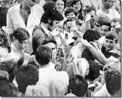 Elvis signing autographs 1969