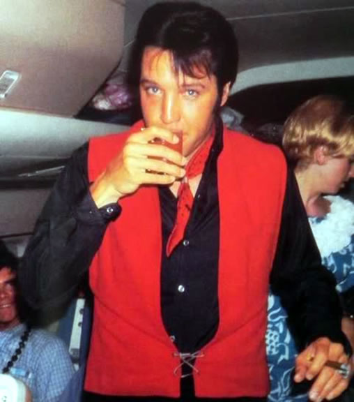 Elvis Presley on a plane from Hawaii to LA, June 2, 1968.